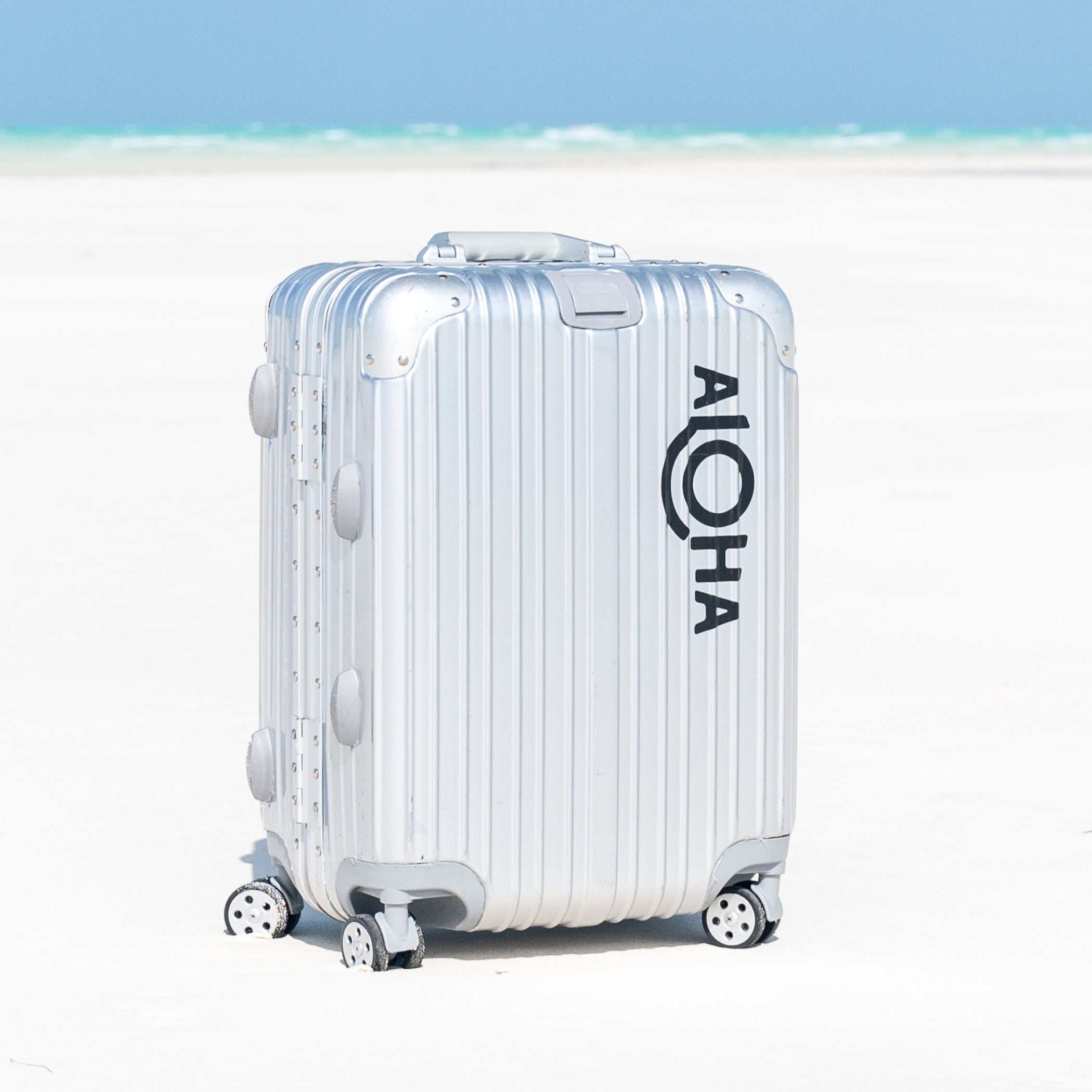 black_ALOHA_logo_decal_suitcase